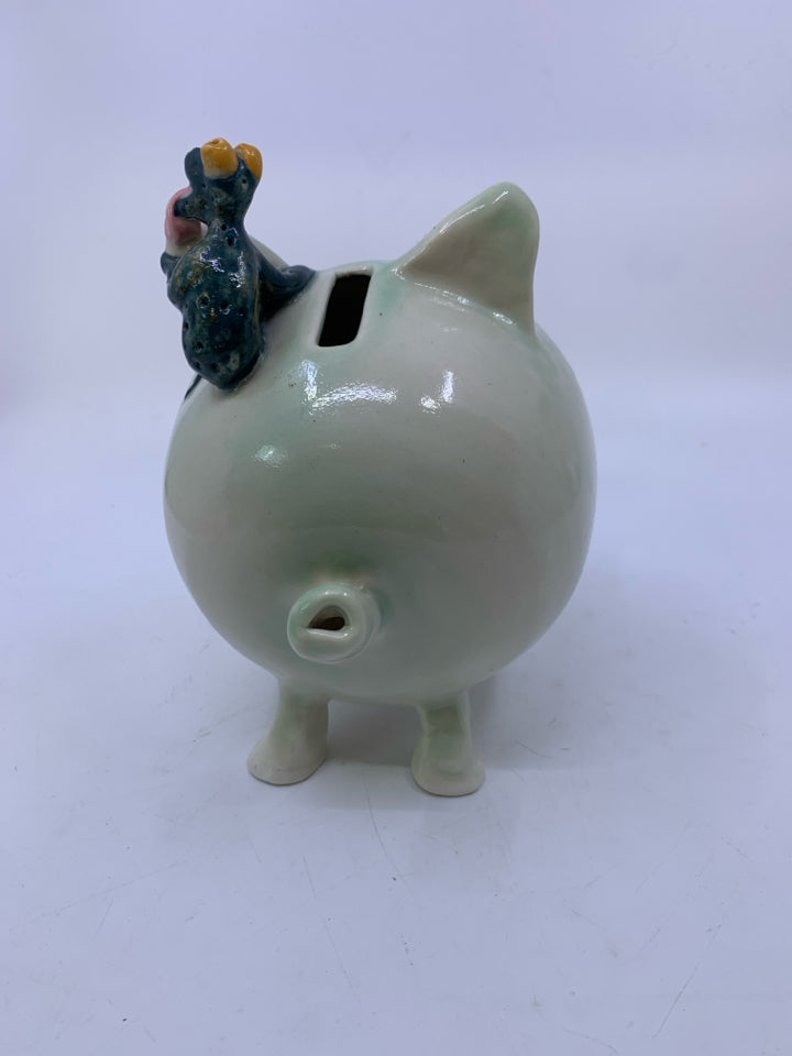 MINT GREEN POTTERY PIGGY BANK W/ CORK NOSE/ FROG LICKING EAR.