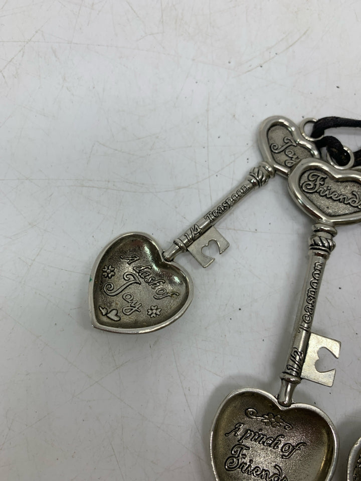4 VTG METAL HEART SHAPED TEASPOONS.