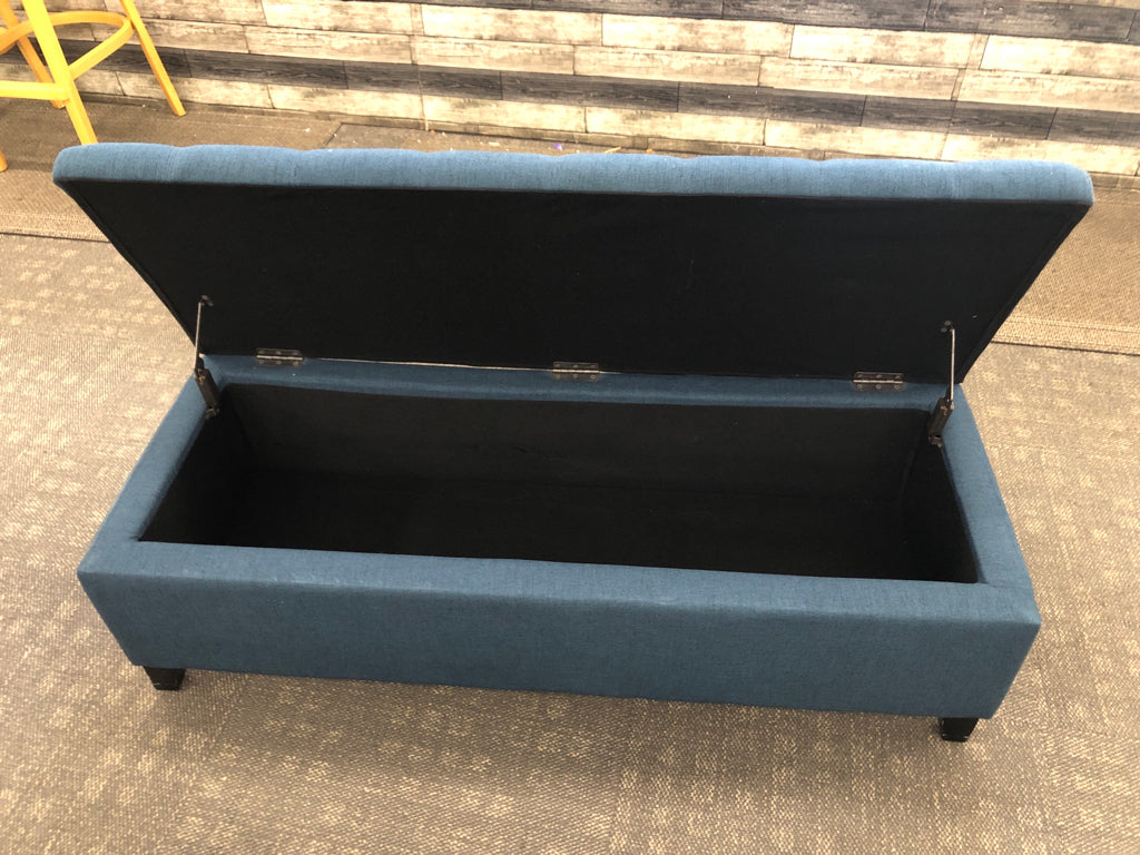 BLUE FABRIC STORAGE BENCH.