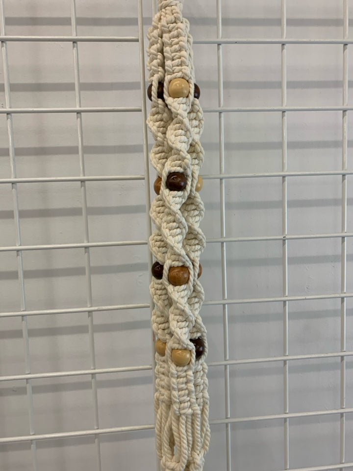 PATTERNED BEAD MACRAME PLANT HOLDER.