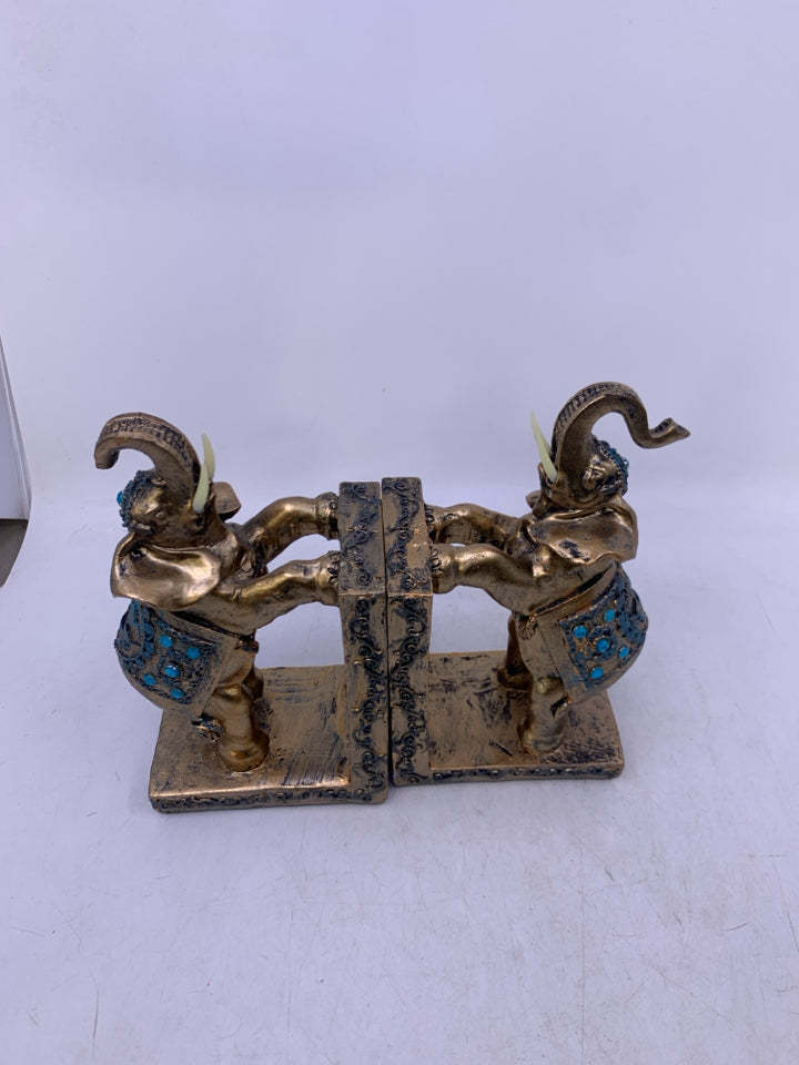 RESIN ELEPHANTS PAINTED GOLD W/ BLUE DETAILS.