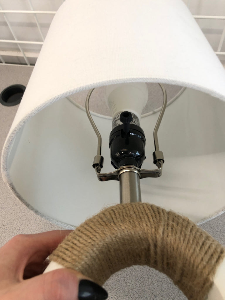 LAMP W/ WHITE SHADE AND ABSTRACT TWINE BASE.