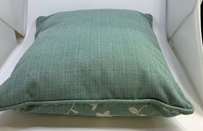 BLUE EMBROIDERED FLOWER PILLOW.