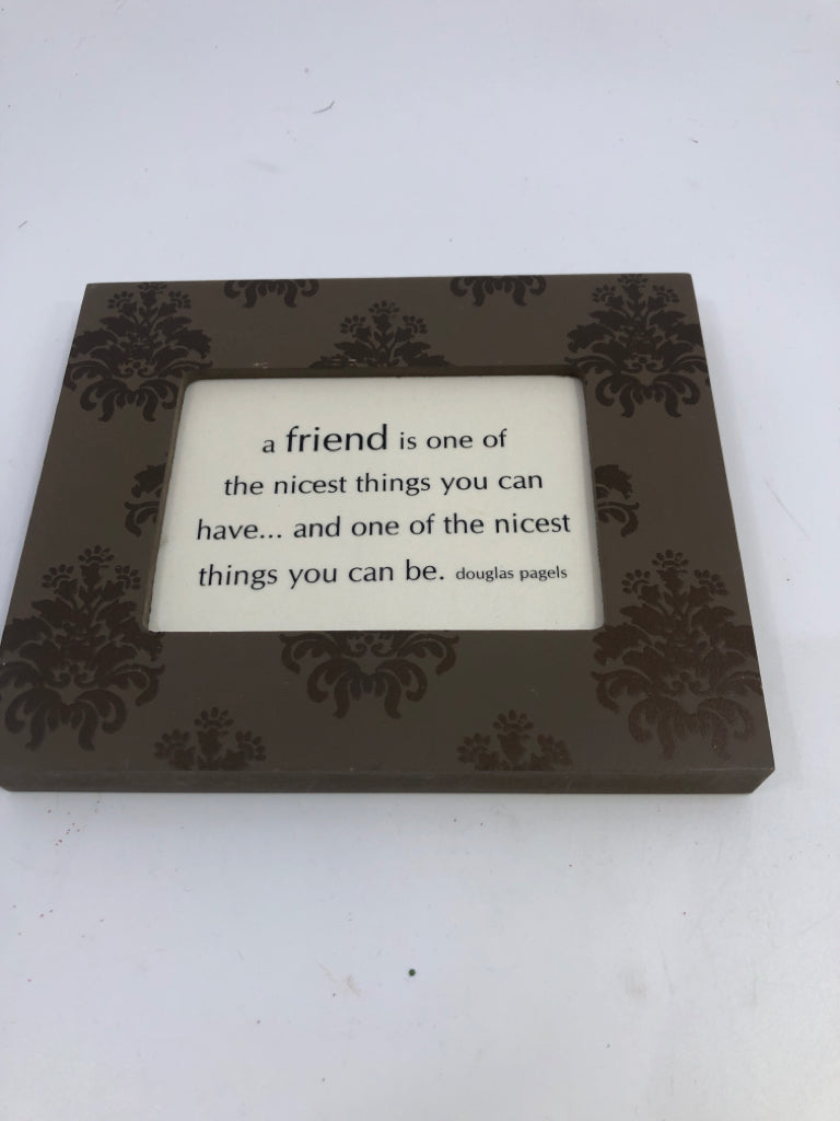 "A FRIEND IS ONE OF THE NICEST" BROWN SCROLL FRAME SIGN.