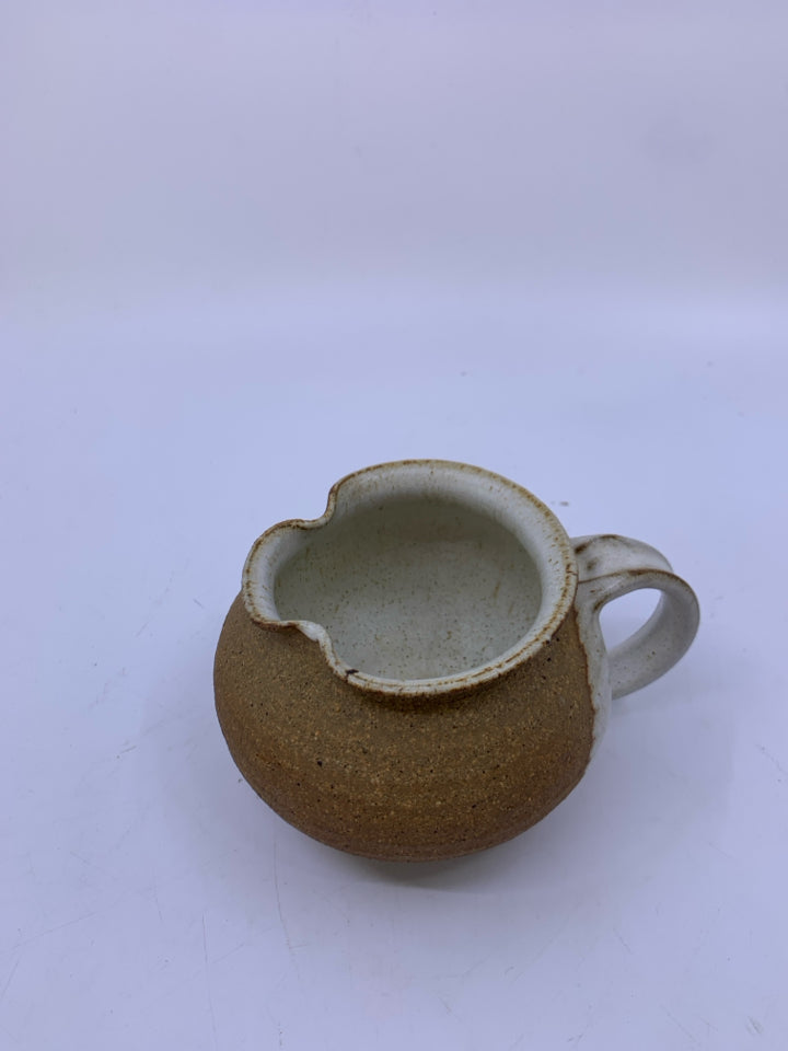 MATTE TAN CREAMER W/ WHITE SPECKLED SIDE/INSIDE POTTERY.