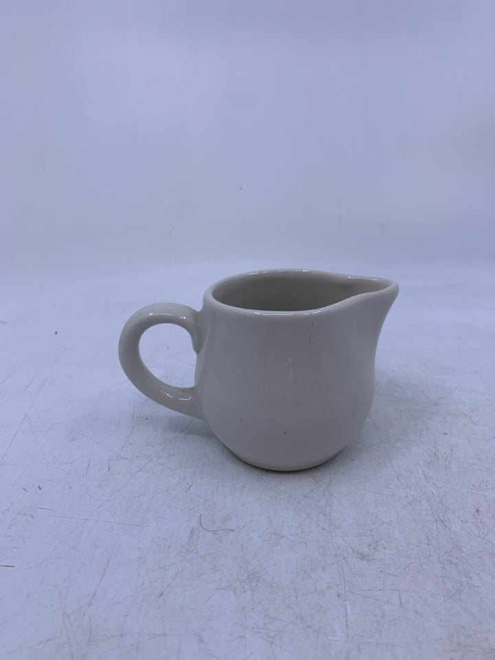 SMALL CREAM COLORED PITCHER.