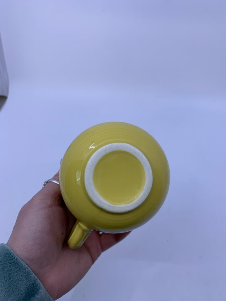SMALL YELLOW RIBBED PITCHER.