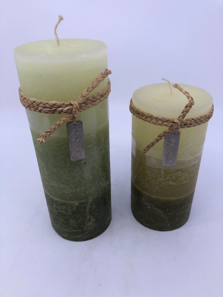 2 GREEN PILLAR CANDLE.
