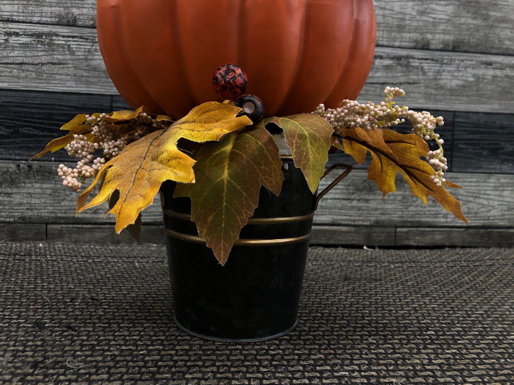 PUMPKIN AND SCARECROW STACK W/LEAVES.