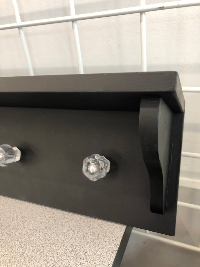 4 HOOK BLACK WALL SHELF W/CLEAR HOOKS.