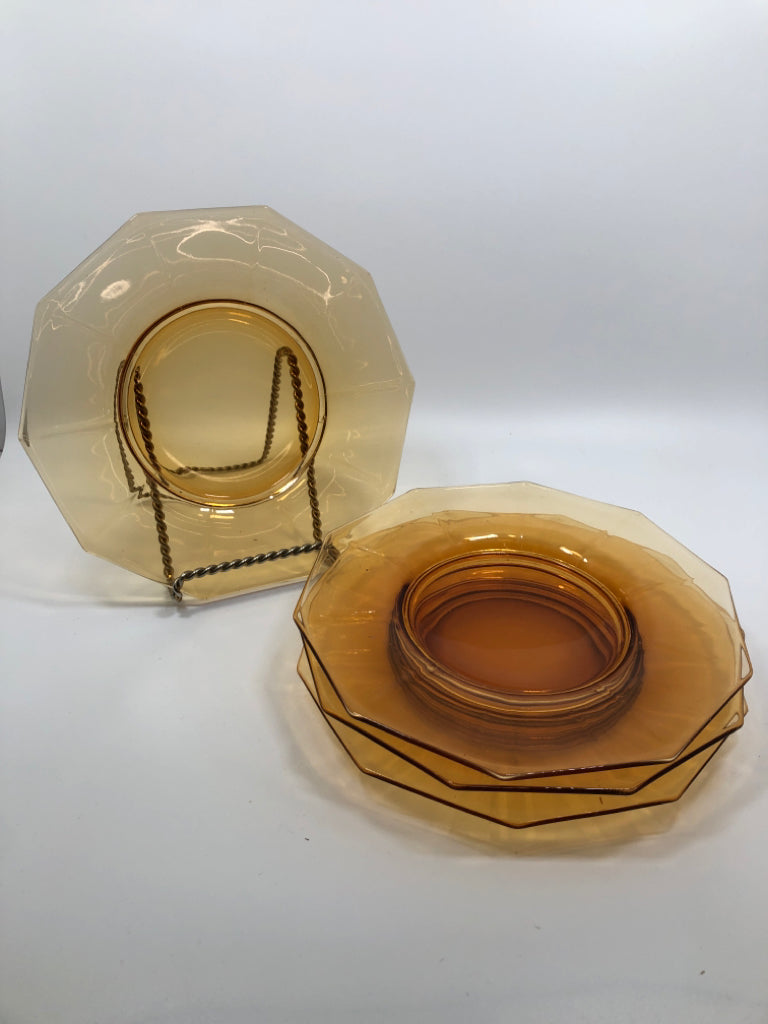 4 AMBER GLASS SIDE PLATES.