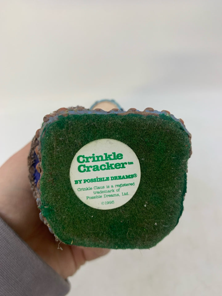 VTG CRINKLE CRACKER HOLDING A DRUM RESIN.