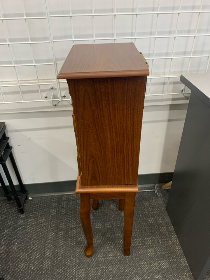 FAUX BROWN WOOD JEWELRY ARMOIRE.