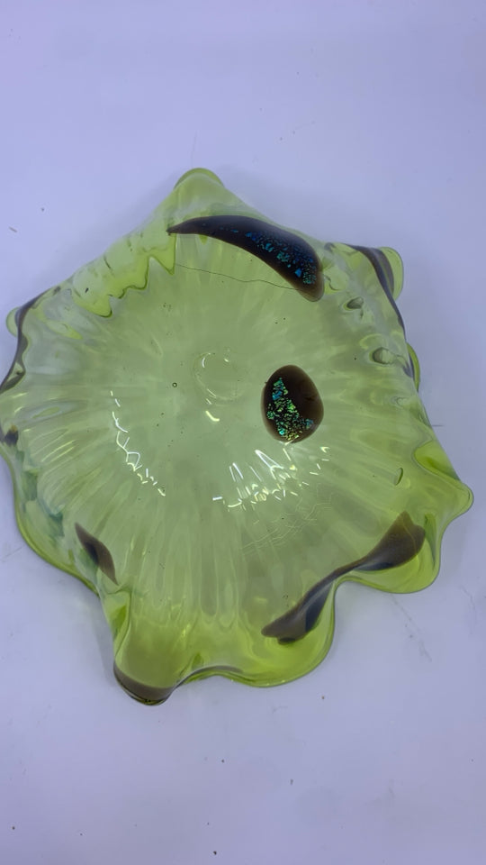 BLOWN LIGHT GREEN GLASS BOWL W/ DARK BROWN SPOTS UNEVEN EDGE.