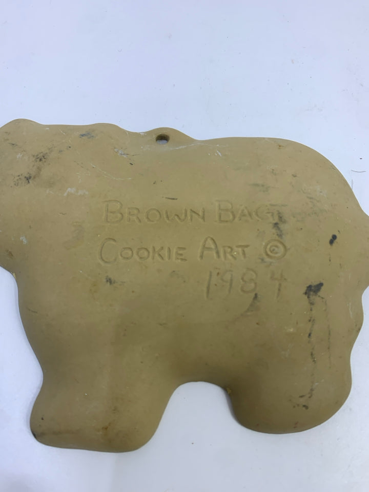 BROWN BAG CERAMIC PIG COOKIE MOLD.