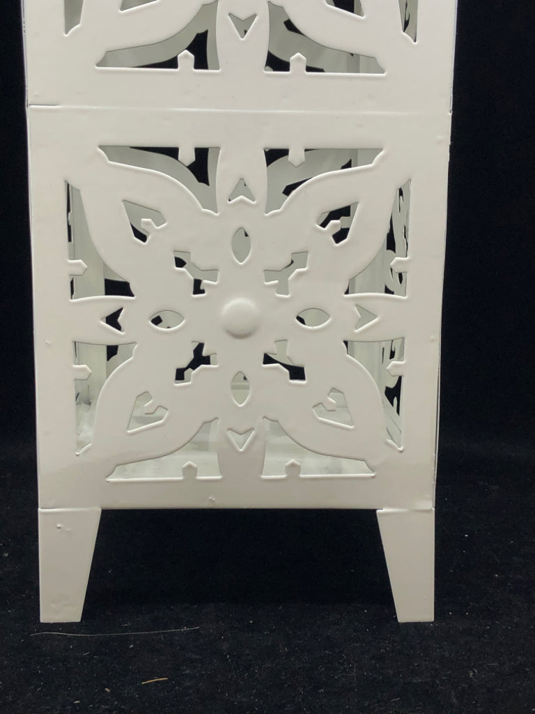 FOOTED WHITE PIERCED METAL LANTERN.