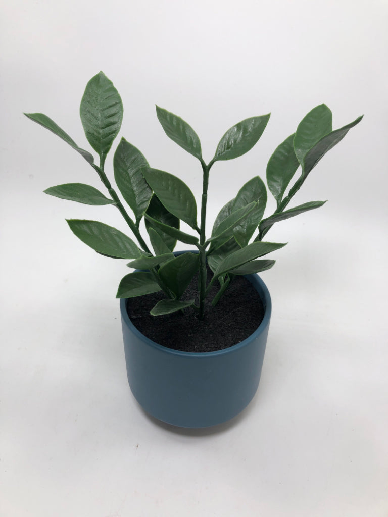 FAUX GREENERY IN BLUE PLANTER.