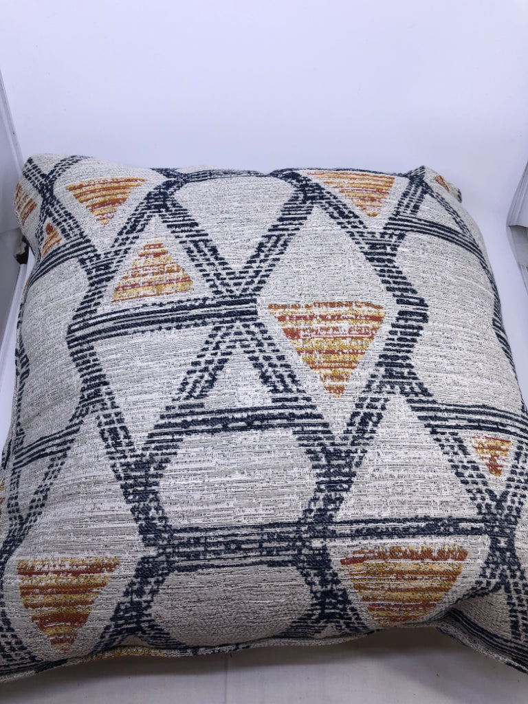 GREY ACCENT PILLOW W ORANGE AND NAVY BLUE ACCENTS.
