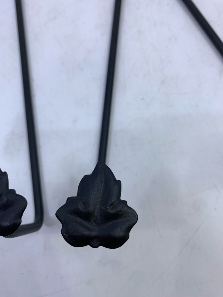 2 BLACK IRON HANGING PLATE HOLDERS W/ LEAVES.