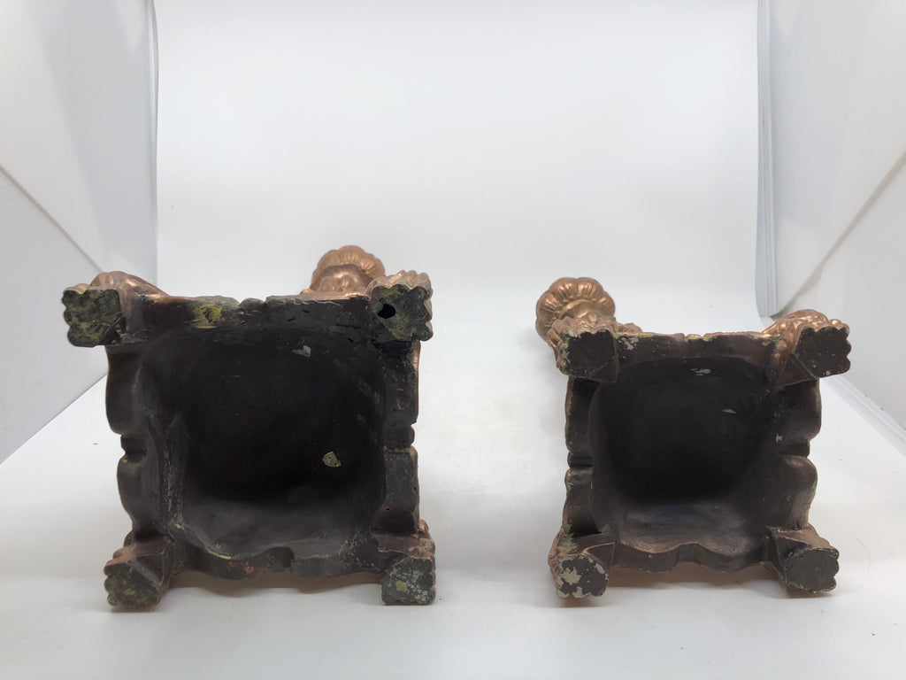 2 ROSE COLORED TAPER CANDLE HOLDERS.