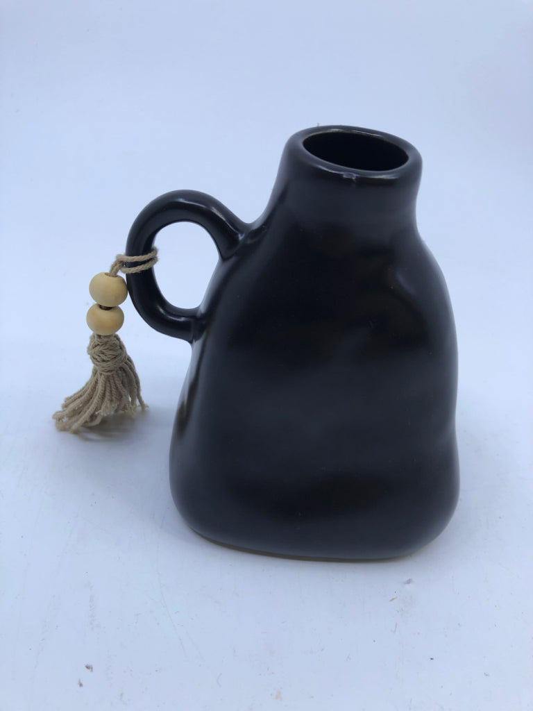 SMALL BLACK JUG/VASE W WOOD BEADS.