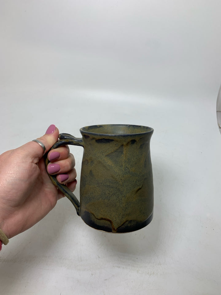 DARK COLORED POTTERY MUG.