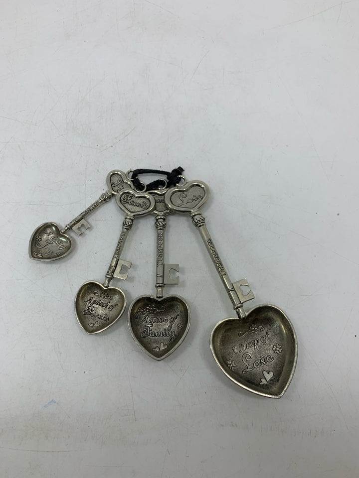 4 VTG METAL HEART SHAPED TEASPOONS.