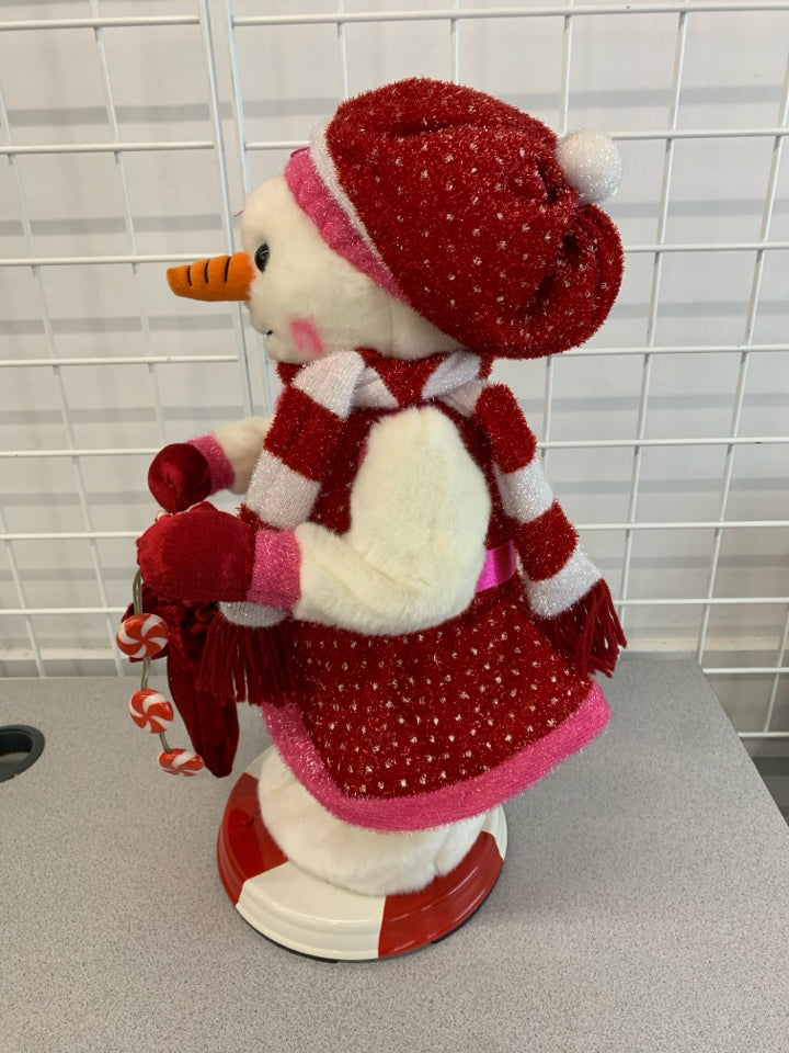 TWIRLING MUSICAL SNOWWOMAN.