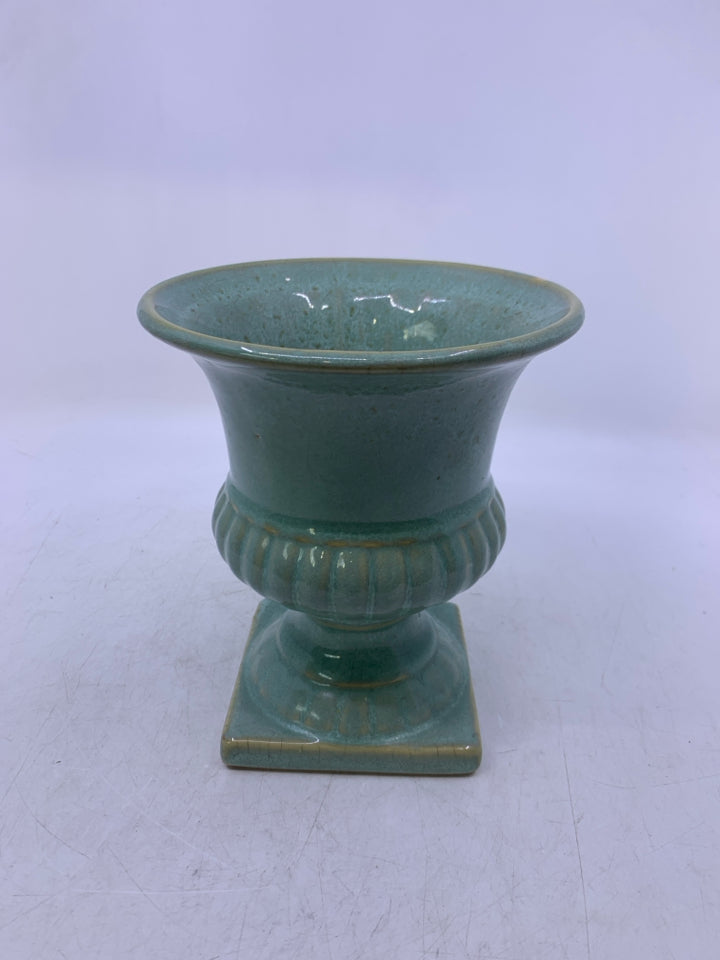 TURQUOISE COLORED URN STYLE PLANTER.