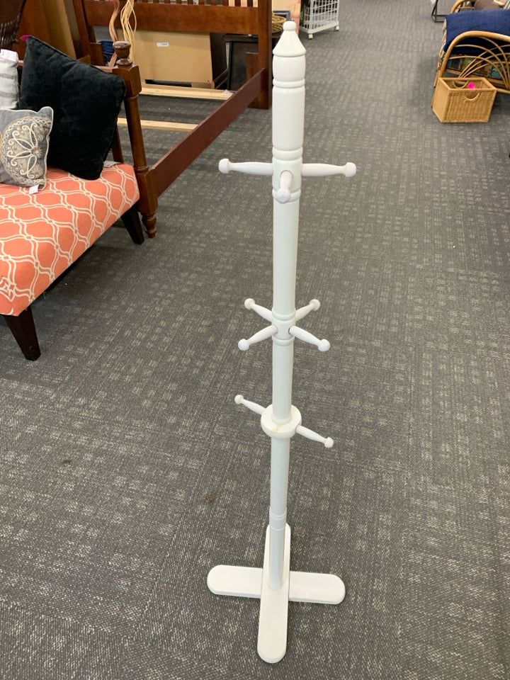 WHITE WOODEN COAT RACK.
