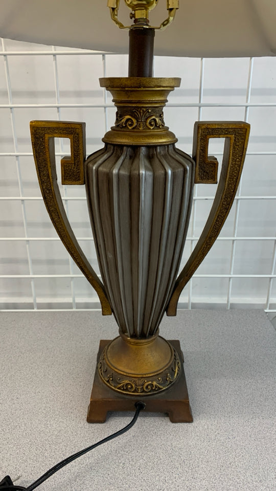 GOLDEN URN SHAPED LAMP W/TAN SHADE.