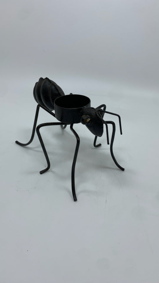 BROWN METAL ANT TEA LIGHT HOLDER.