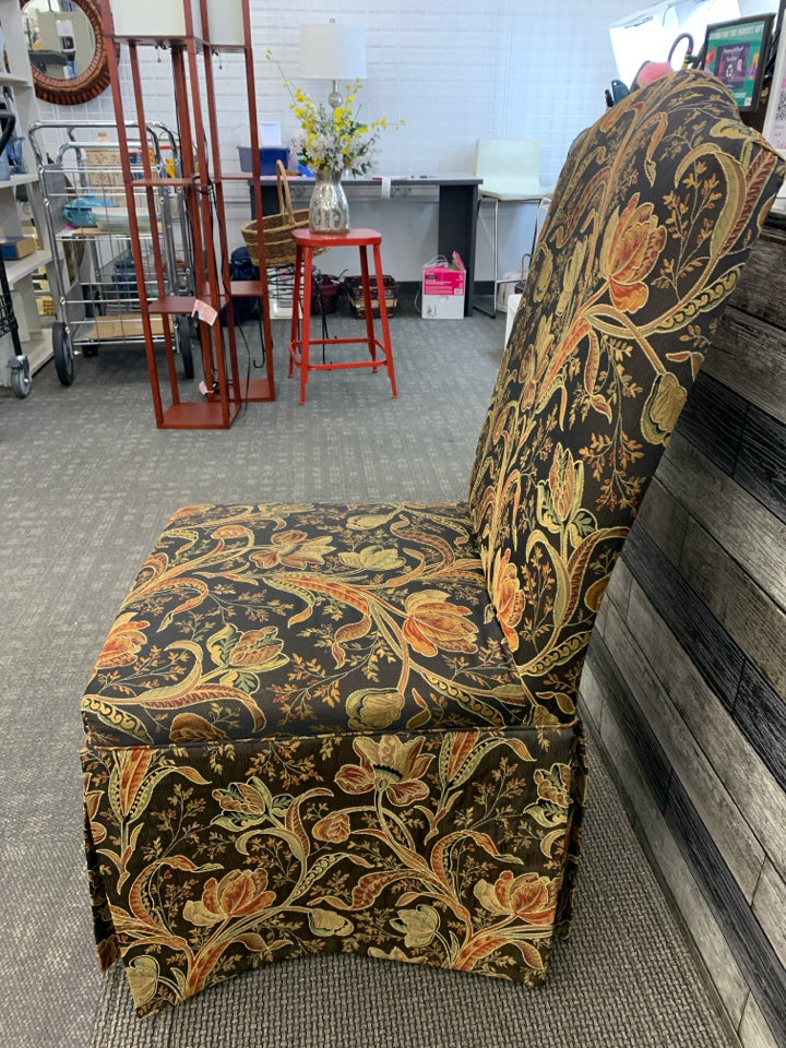 BLACK FLORAL UPHOLSTERED SLIPPER CHAIR.