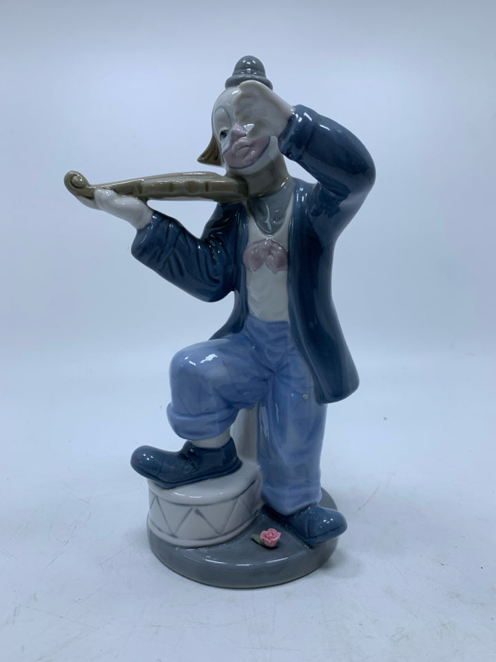 PORCELAIN CLOWN PLAYING THE FIDDLE CUERNAVACA MEXICO.