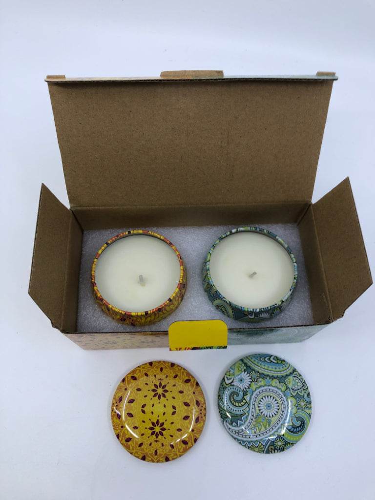 2 NIB SCENTED TIN CANDLES.
