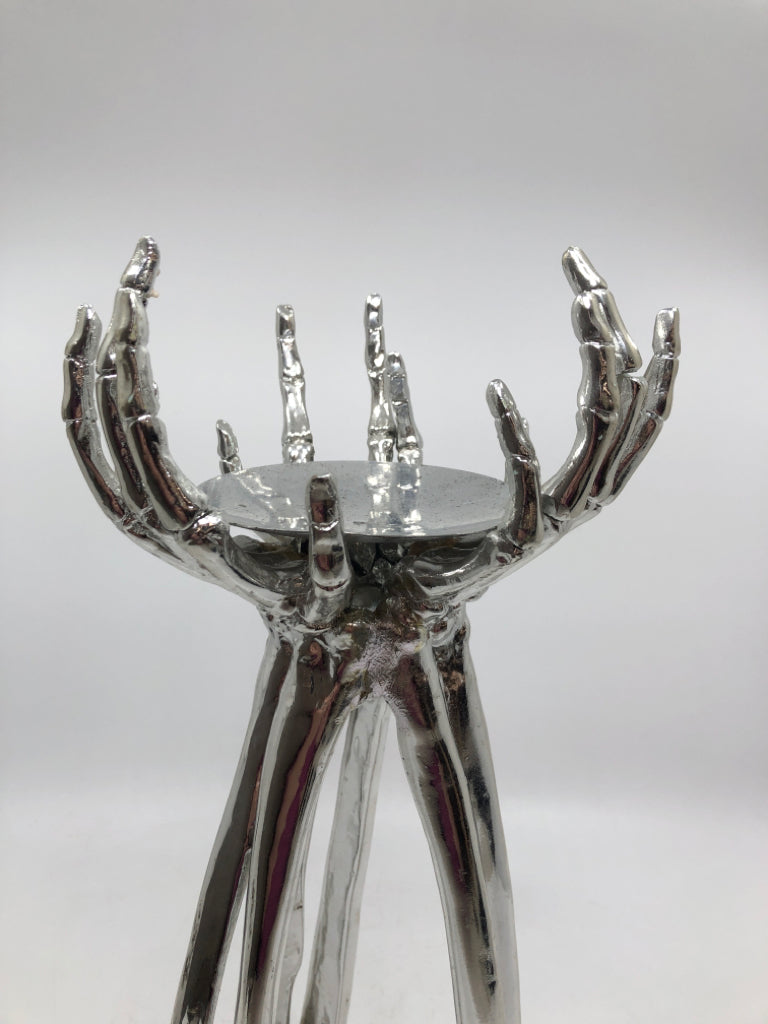 SILVER SKELETON HANDS PILLAR CANDLE HOLDER.