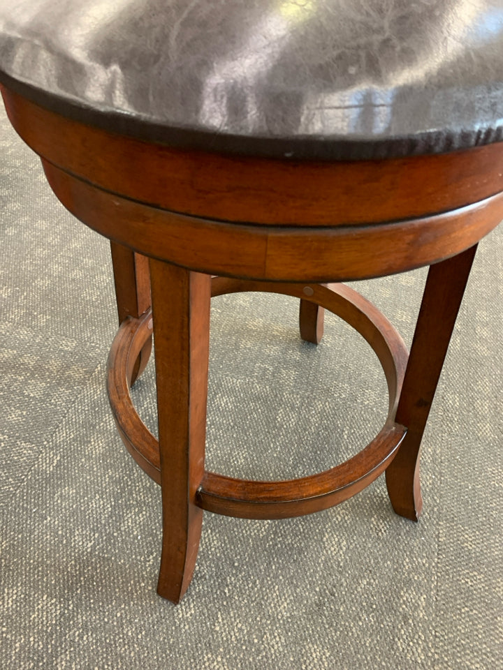 DARK WOODEN BARSTOOL W/ FAUX LEATHER SEAT.