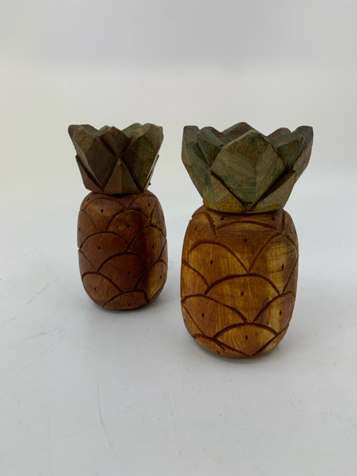 2 WOOD CARVED PINEAPPLE TAPERED CANDLE HOLDERS.
