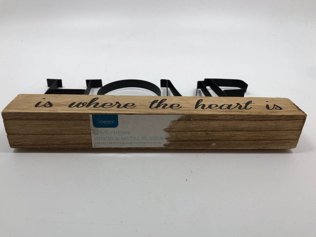 "HOME" METAL SIGN ON WOOD BLOCK.