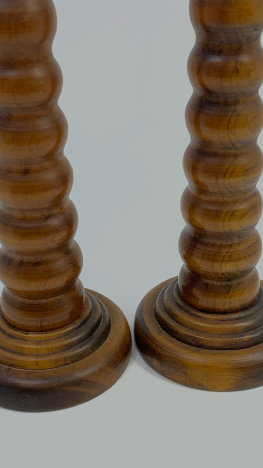 2 WOOD RIBBED TAPERED CANDLESTICK HOLDERS.