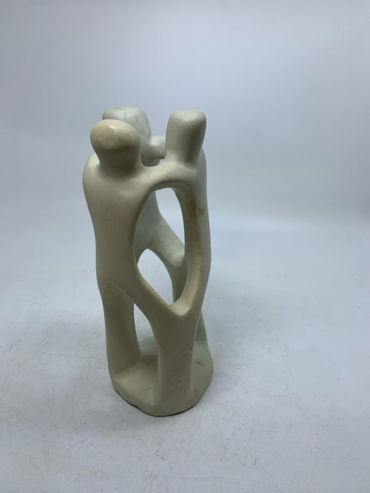 HEAVY ABSTRACT 3 PEOPLE EMBRACING SCULPTURE.