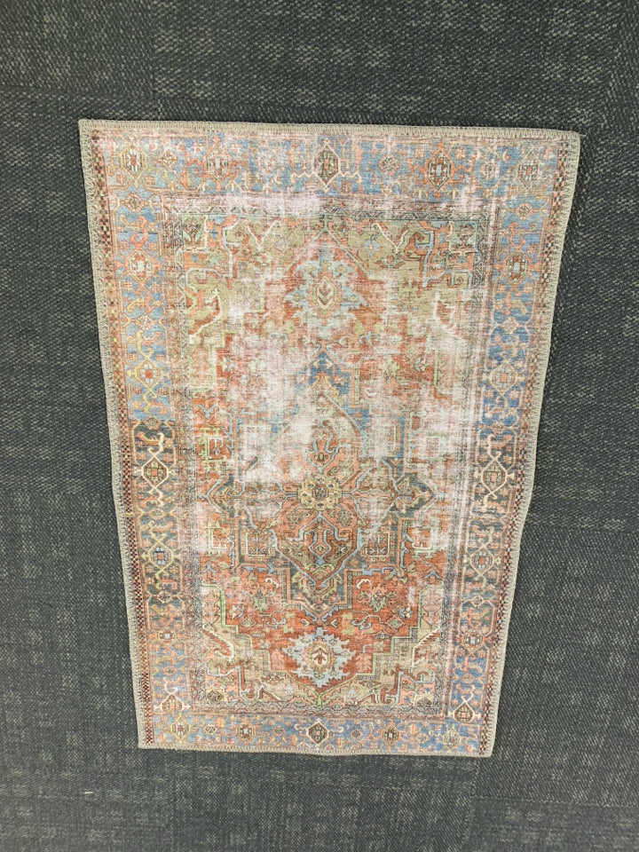 TERRACOTTA/BLUE RUG.