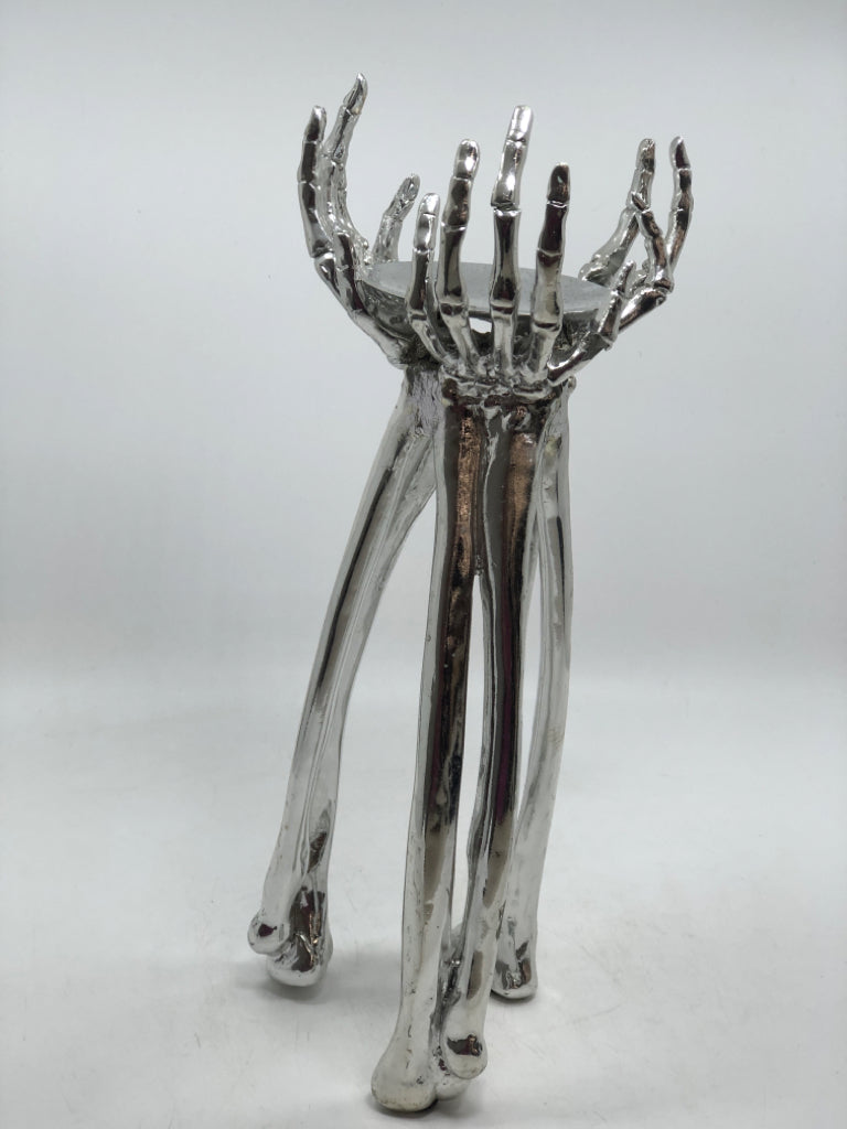 SILVER SKELETON HANDS PILLAR CANDLE HOLDER.