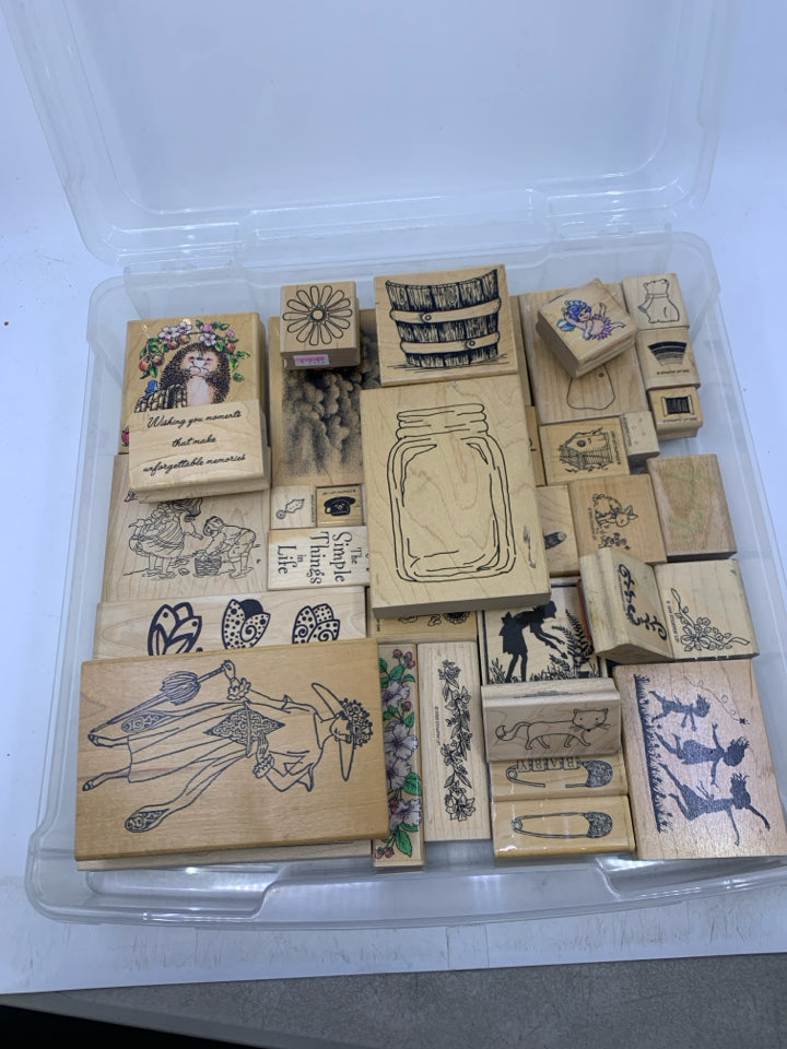 35 ASSORTED STAMPS IN CLEAR PLASTIC CASE.