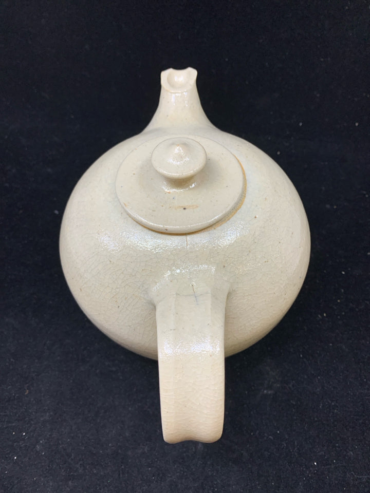 TAN POTTERY TEAPOT.