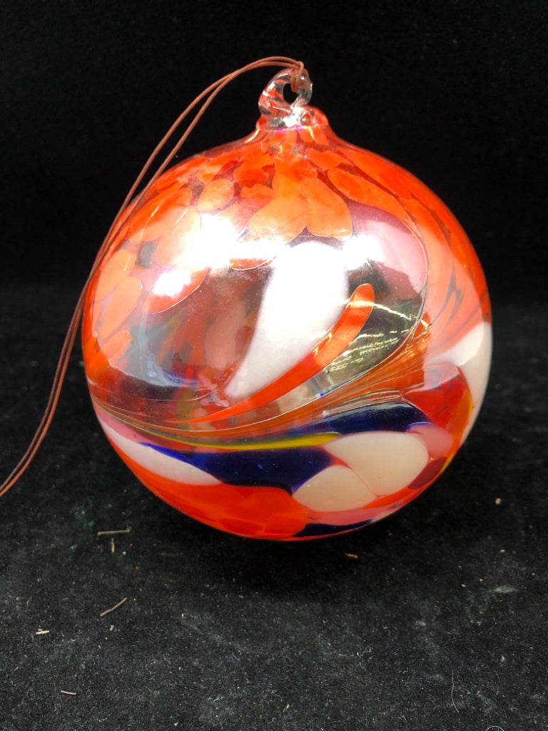 BLOWN GLASS ORANGE FLORAL DESIGN BALL.