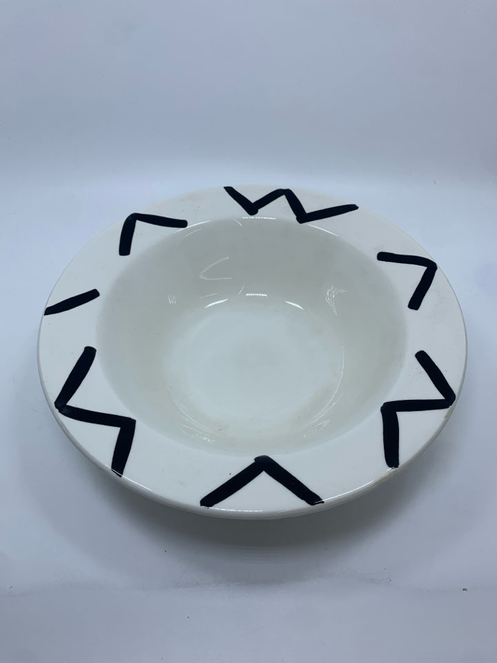 WHITE CERAMIC BOWL W/BLACK LINES.