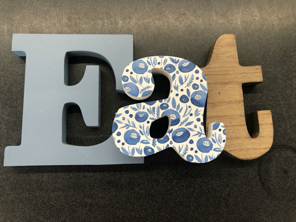 BLUE AND WHITE EAT SIGN.