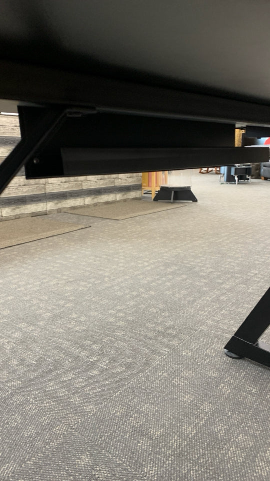 BLACK PLASTIC GAMING DESK W/ANGLED METAL LEGS.