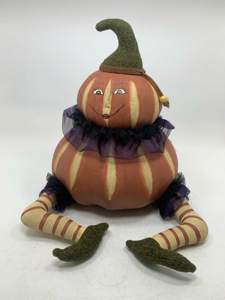 PRIMITIVE PAINTED PLUSH SITTING PUMPKIN WITH RUFFLES.